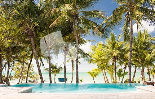 Image of swimming pool on tropical beach