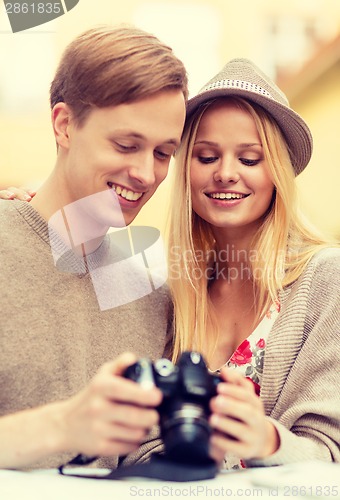 Image of couple with photo camera