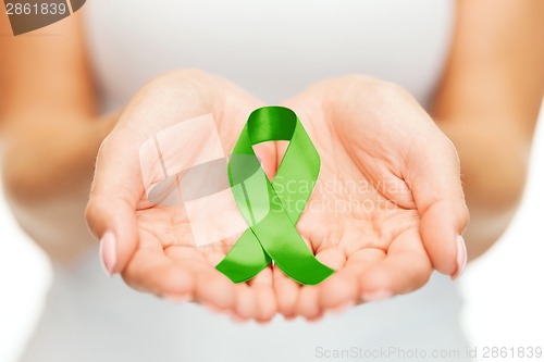 Image of hands holding green awareness ribbon