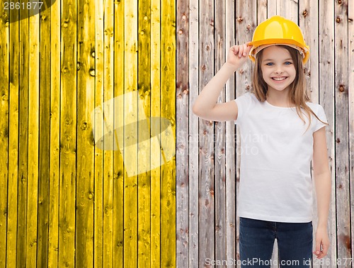 Image of smiling little girl in protective helmet