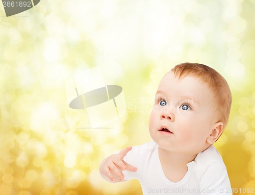 Image of curious baby looking up