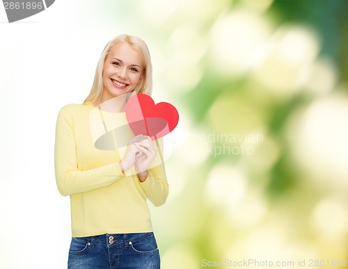 Image of smiling woman with red heart