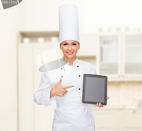 Image of smiling female chef with tablet pc blank screen