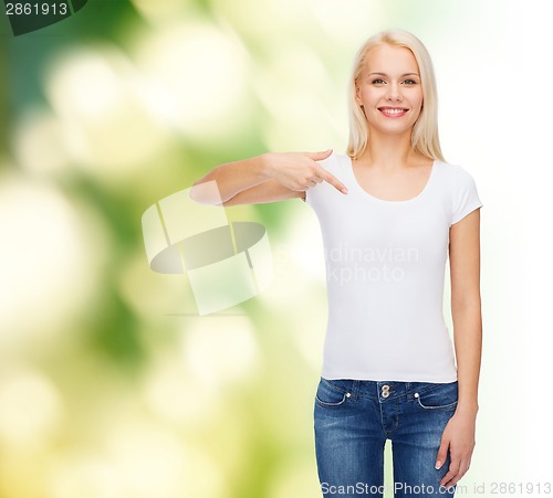 Image of smiling young woman in blank white t-shirt