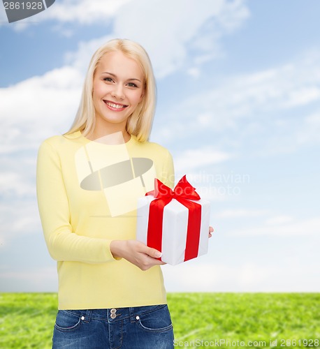 Image of smiling girl with gift box
