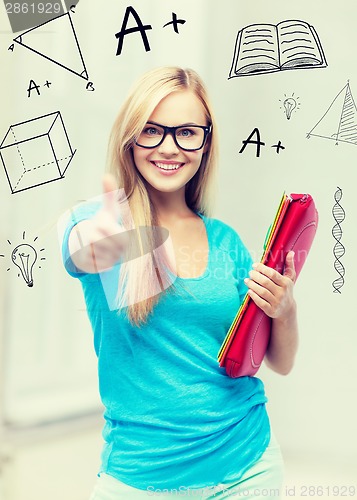 Image of smiling student with folders