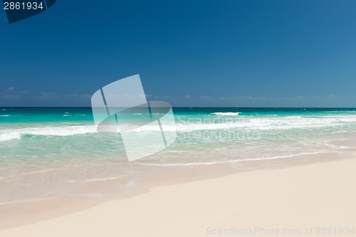 Image of blue sea or ocean, white sand and sky