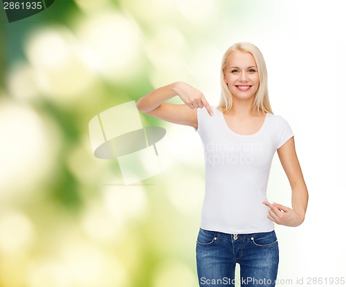 Image of smiling young woman in blank white t-shirt
