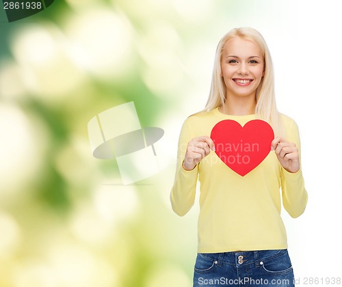 Image of smiling woman with red heart