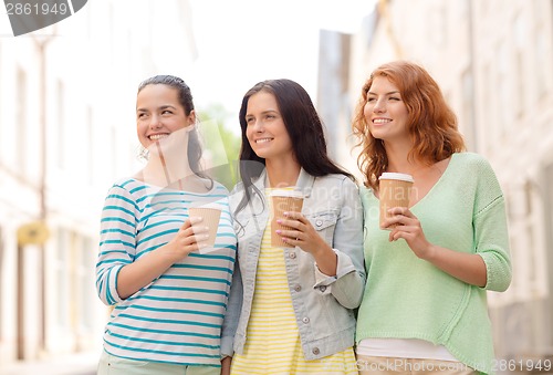 Image of smiling teenage girls with on street