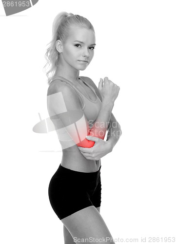 Image of sporty woman with pain in elbow