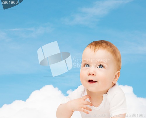 Image of smiling baby looking up