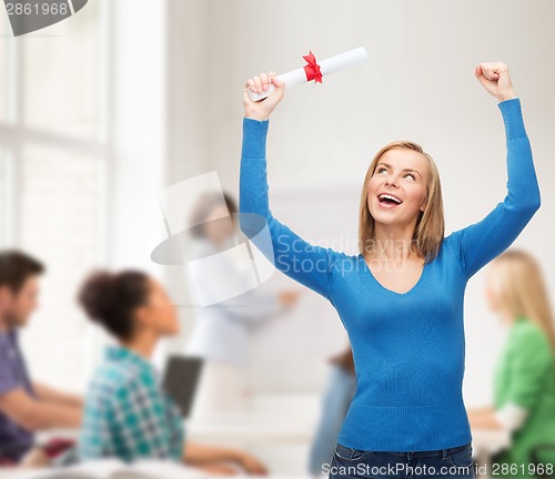 Image of smiling woman with diploma
