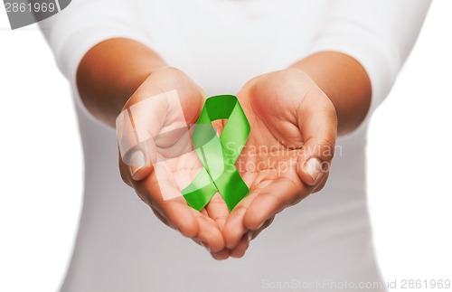 Image of hands holding green awareness ribbon