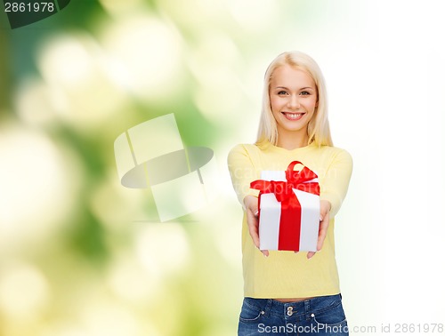 Image of smiling girl with gift box