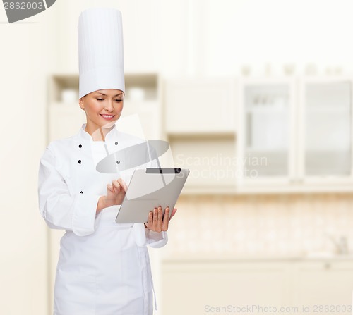 Image of smiling female chef with tablet pc computer