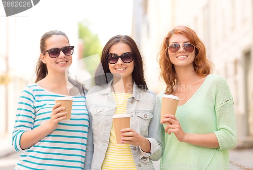 Image of smiling teenage girls with on street