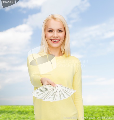 Image of smiling girl with dollar cash money