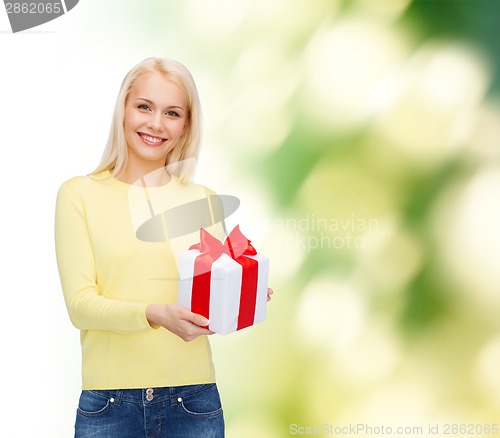 Image of smiling girl with gift box