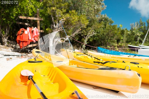 Image of canoes on sandy beach