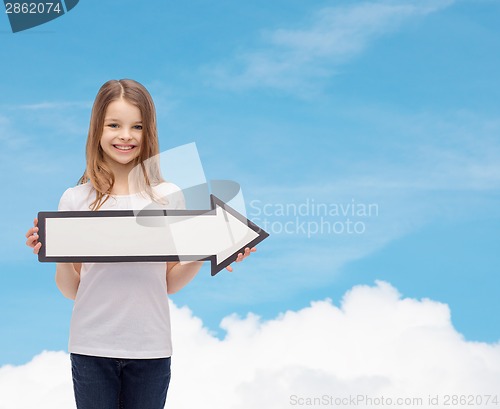 Image of smiling girl with blank arrow pointing right