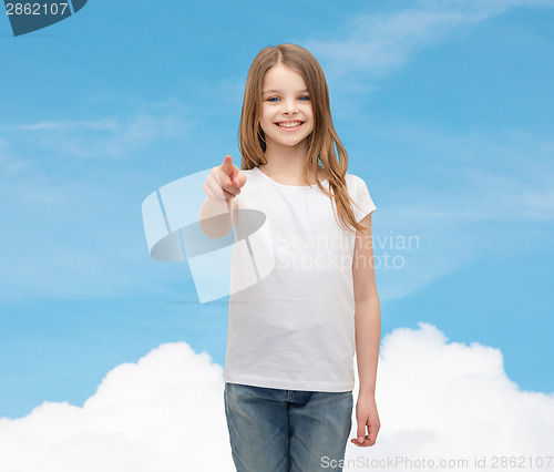 Image of little girl in blank white t-shirt pointing at you