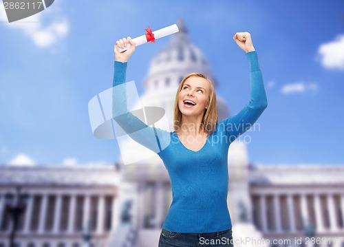 Image of smiling woman with diploma