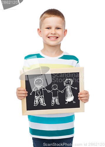 Image of smiling little boy holding chalkboard with family