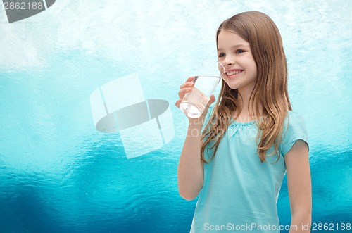 Image of smiling little girl with glass of water