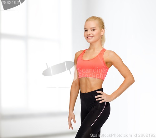 Image of beautiful athletic woman in sportswear