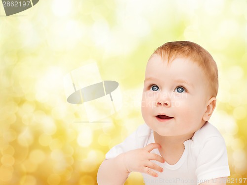 Image of smiling baby looking up