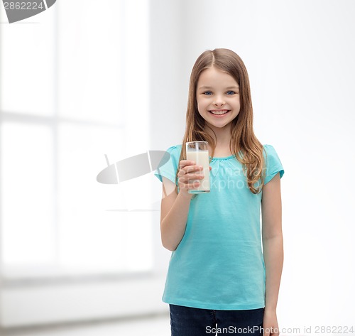 Image of smiling little girl with glass of milk