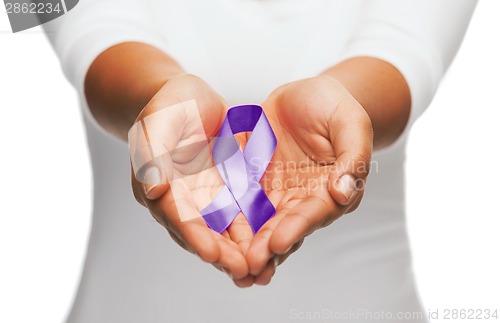 Image of hands holding purple awareness ribbon