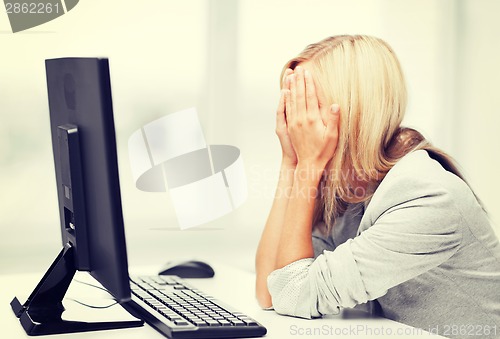 Image of stressed woman with computer