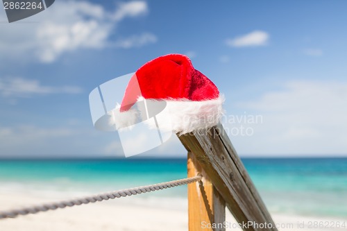 Image of close up of santa helper hat on beach