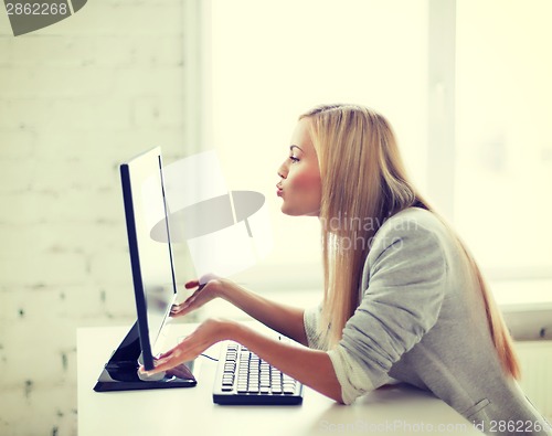 Image of happy woman with laptop computer