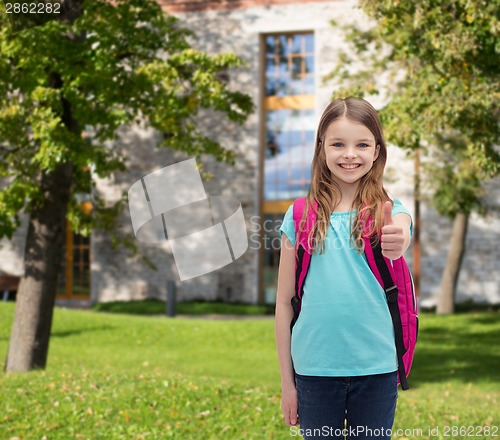 Image of smiling girl with school bag showing thumbs up