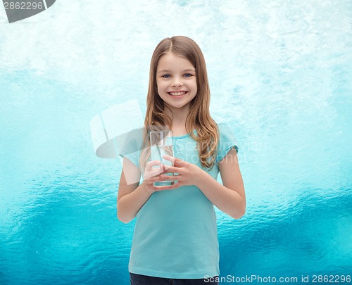 Image of smiling little girl with glass of water