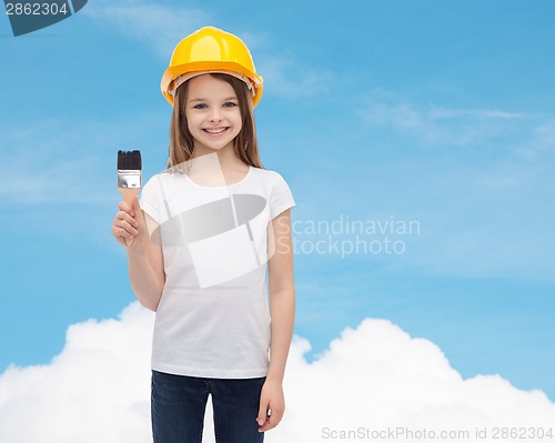 Image of smiling little girl in helmet with paint roller