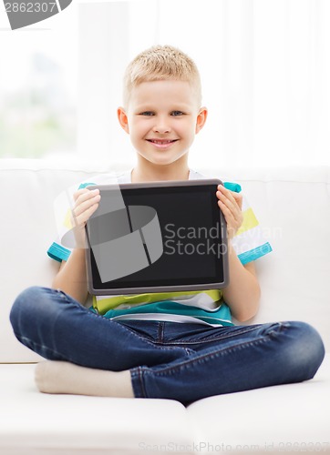 Image of smiling boy with tablet pc computer at home
