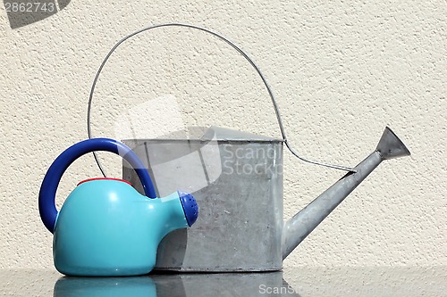 Image of Two Watering Cans