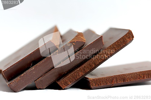 Image of Close up of Cut Chocolate Pieces on White Background