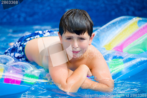 Image of Boy in swimming pool 