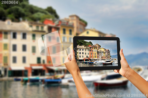 Image of Portofino Woman taking pictures on a tablet
