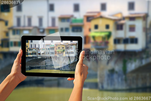 Image of Ponte Vecchio Woman taking pictures on a tablet