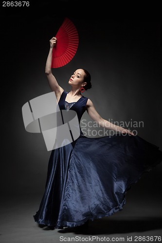 Image of woman dancing flamenco on black