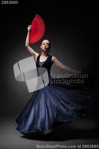 Image of woman dancing flamenco on black