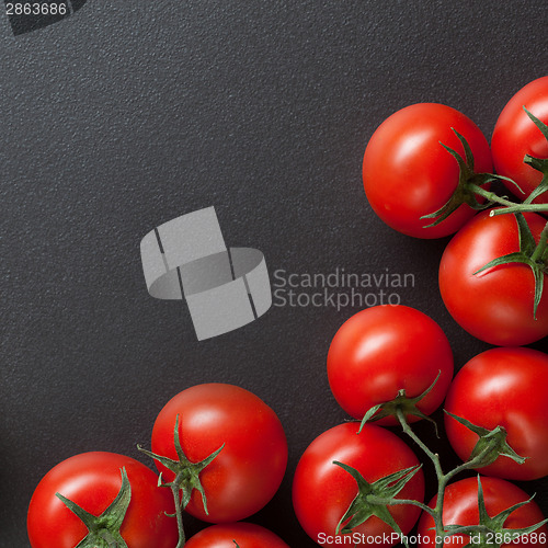 Image of red tomatoes on blac