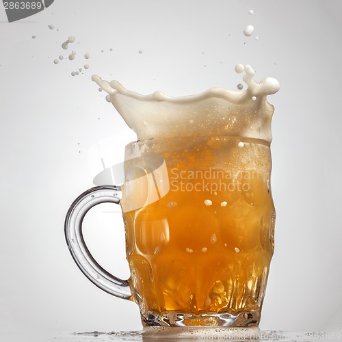 Image of Beer splash in glass isolated on white