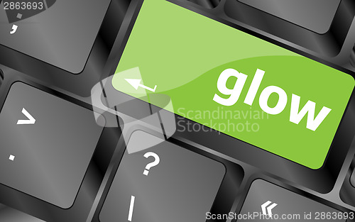 Image of glow word on keyboard key, notebook computer button